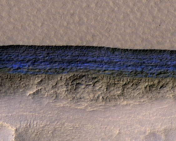 A cross-section of underground ice is exposed at a steep slope that appears bright blue in this enhanced-color view taken by NASA's Mars Reconnaissance Orbiter. Mars Reconnaissance Orbiter (MRO)