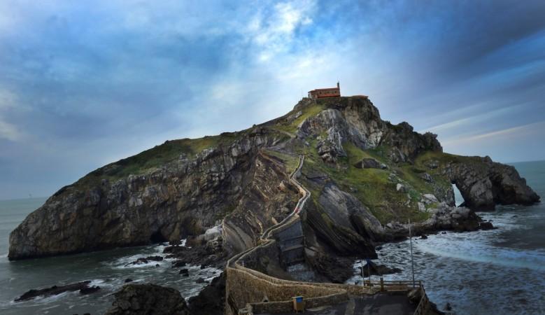 Visitors climb the steps towards the islet of San Juan de Gaztelugatxe, featured in the American television series Game of Thrones, on the Basque coastline 35km (21 miles) from Bilbao, Spain spain photo