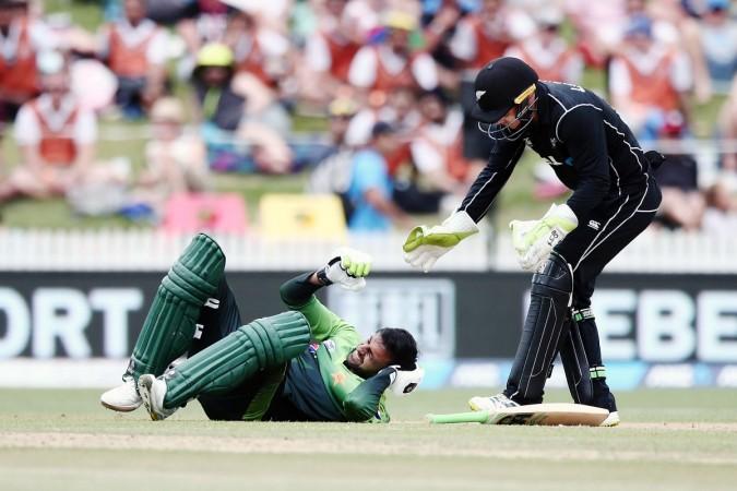 Shoaib Malik of Pakistan gets hit on the head by a ball as Tom Latham of New Zealand rushes to him during game four of the One Day International Series between New Zealand and Pakistan at Seddon Park on January 16, 2018 in Hamilton, New Zealand shoaib malik