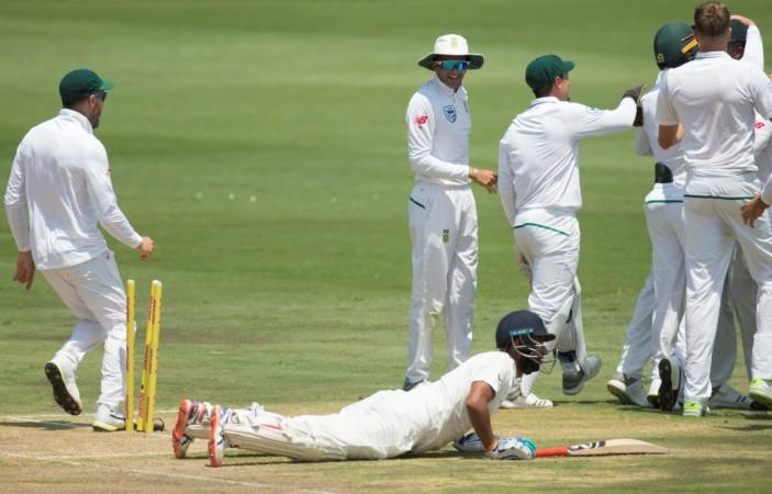 South Africa's players celebrate after the run out of India's Cheteshwar Pujara in the first innings of the second Test in Centurion. Pujara was run out in the second innings too. Cheteshwar Pujara