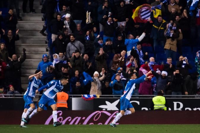 Sergio Garcia of RCD Espanyol celebrates with teammates after scoring the opening goal during the La Liga match between Espanyol and Atletico Madrid at RCDE Stadium on December 22 espanyol