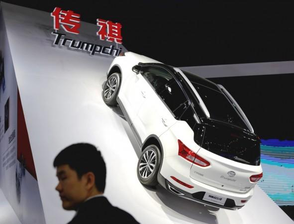 A man stands in front of Trumpchi GS4 from GAC Group displayed at the Shanghai Auto Show, in Shanghai, China April 20, 2017 Trumpchi