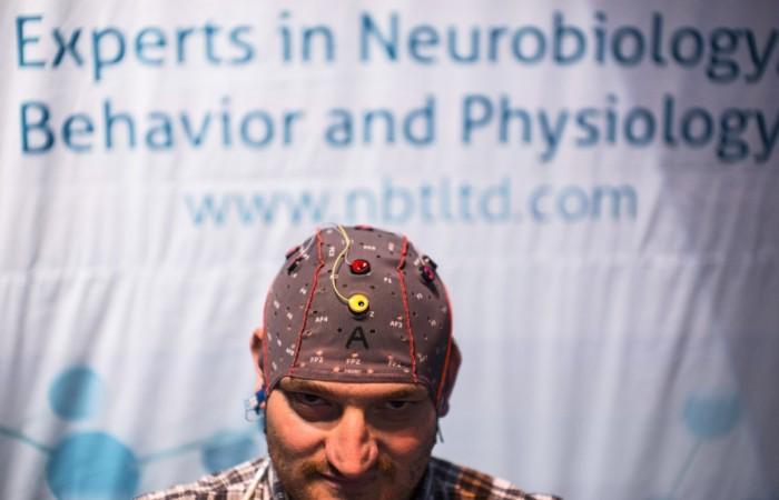 A man demonstrates how he uses a keyboard without typing by wearing a skull-cap with sensors, at a conference on brain technology in Tel Aviv October 15, 2013 Brain control