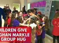 Meghan Markle receives group hug from school children