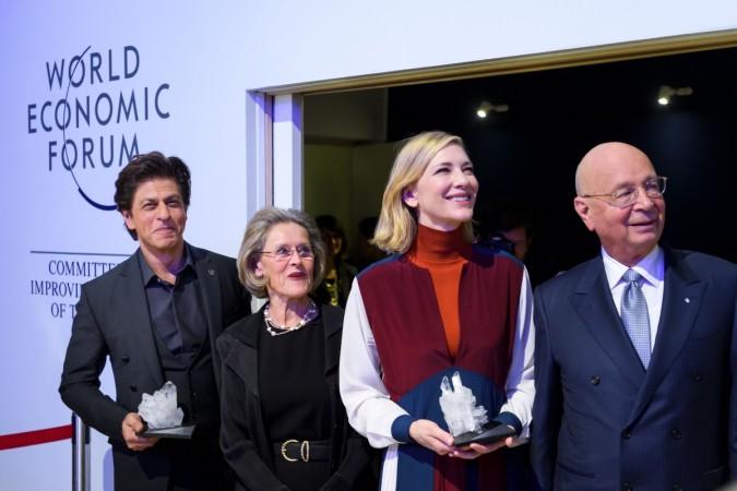 (From L) Indian Bollywood actor Shah Rukh Khan, Schwab Foundation for Social Entrepreneurship Chairperson and Co-Founder Hilde Schwab, Australian actress Cate Blanchett and Founder and Executive Chairman of the World Economic Forum (WEF) Klaus Schwab pose after the Crystal Award ceremony ahead of the World Economic Forum (WEF) 2018 annual meeting, on January 22, 2018 in Davos, eastern Switzerland. Shah Rukh Khan