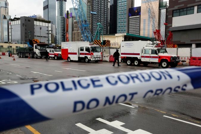 Members of the police bomb squad cordon off an area where a World War Two bomb was found at a construction site in Hong Kong, China January 31, 2018. Members of the police bomb squad cordon off an area where a World War Two bomb was found at a construction site in Hong Kong