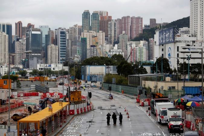 Members of the police bomb squad cordon off an area where a World War Two bomb was found at a construction site in Hong Kong, China January 31, 2018. Members of the police bomb squad cordon off an area where a World War Two bomb was found at a construction site in Hong Kong