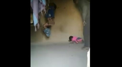The man flogging his children. The man flogging his children.