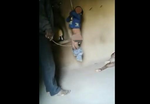 The man flogging his children. The man flogging his children.