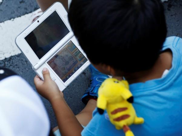 boy playing nintendo