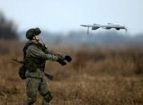 A Russian soldier launches a drone during a joint Serbian-Russian military training exercise