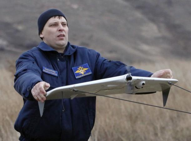 A police officer launches a Russian-made drone, an unmanned aerial vehicle (UAV), A police officer launches a Russian-made drone, an unmanned aerial vehicle (UAV),