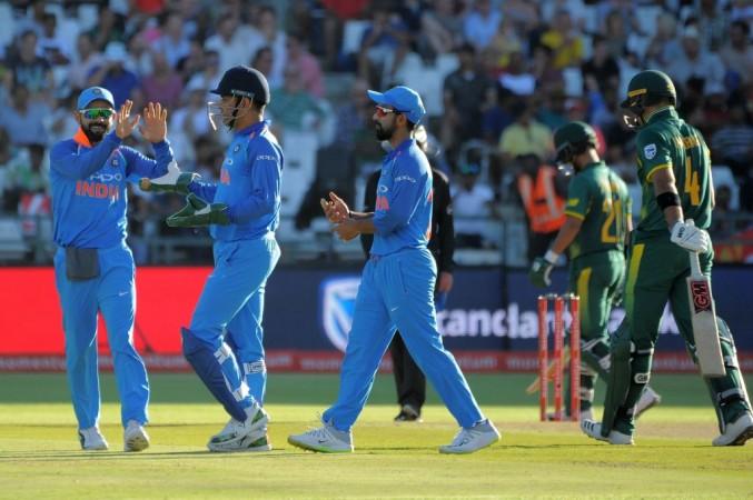 India celebrate the dismissal of Aiden Markram (R) during the 3rd ODI in Cape Town on February 7, 2018. Indian cricket team
