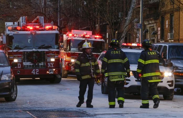 Representational image Fire Department of New York personnel work on the scene of an apartment fire on December 29, 2017 in the Bronx borough of New York City. Officials said Friday that the death toll from the fire has reached 12, including four children.