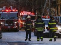 Fire Department of New York personnel work on the scene of an apartment fire on December 29, 2017 in the Bronx borough of New York City. Officials said Friday that the death toll from the fire has reached 12, including four children.