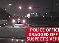 Intoxicated driver speeds away, drags police officer with him