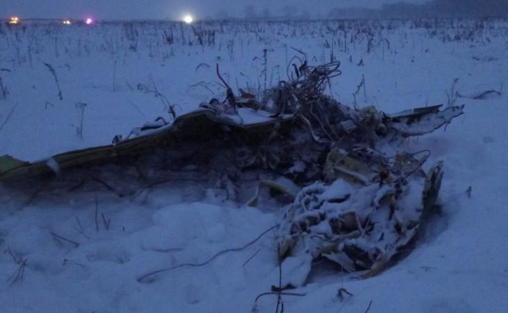 A part of a Saratov Airlines Antonov AN-148 plane that crashed after taking off from Moscow's Domodedovo airport, is seen at the scene of the incident outside Moscow Saratov Airlines