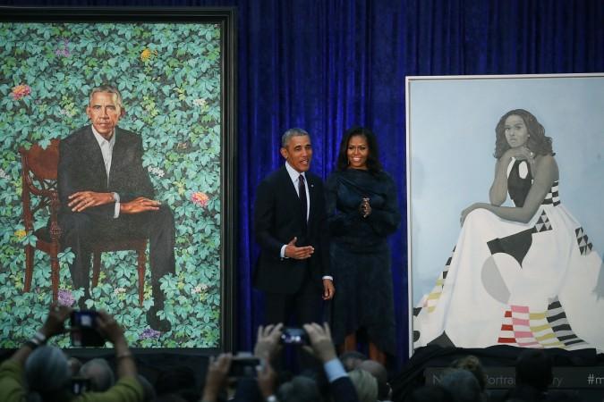 Barack Obama and Michelle Obama stand next to their newly unveiled portraits during a ceremony at the Smithsonian's National Portrait Gallery. Michelle Obama portrait, Barack Obama, Michelle Obama