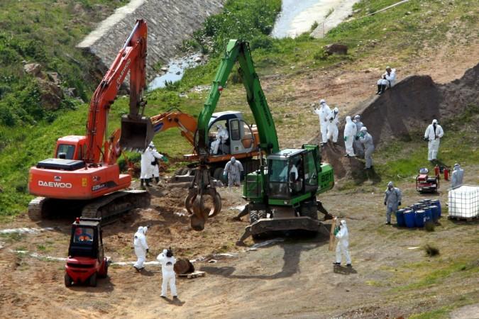 Turkish officials in protective suits unearth barrels containing toxic waste near Orhanli Istanbul