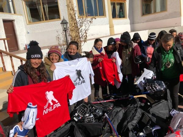 Girls are all excited after they got their all-new sporting gears. Ice hockey