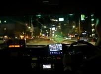 In this picture taken on December 12, 2017, a taxi driver uses a navigator while driving in Tokyo. Uber may be shredding business models for taxi firms the world over but it is struggling to make inroads in Japan, where risk-averse passengers prefer to st