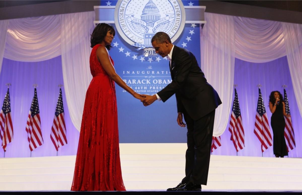 Barack Obama bows to Michelle Obama at the Inaugural ball in Washington, January 21, 2013. Barack and Michelle Obama