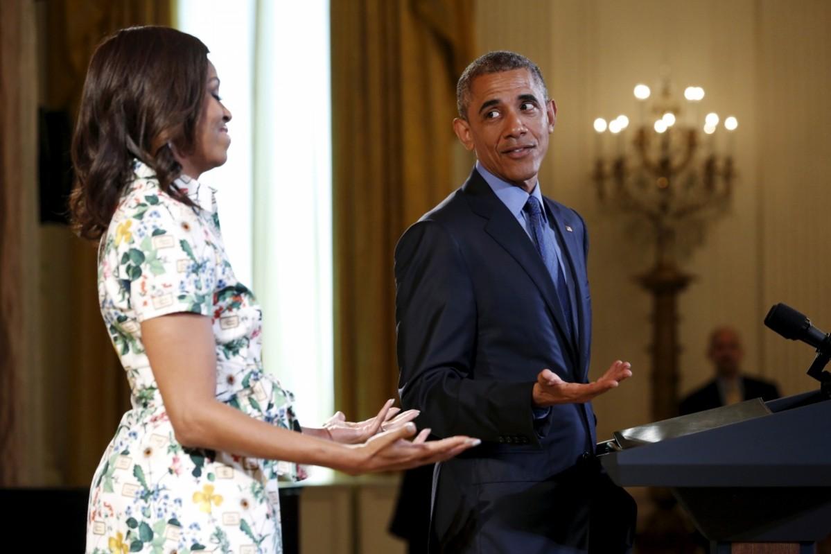 Barack Obama (R) jokes about enjoying guacamole as he joins Michelle Obama to welcome children to a Kids' State Dinner at the White House in Washington July 10, 2015. The children are winners of a Healthy Lunchtime Challenge, and were invited to the White House with their parents to celebrate with a lunch of the winning recipes. Barack and Michelle Obama