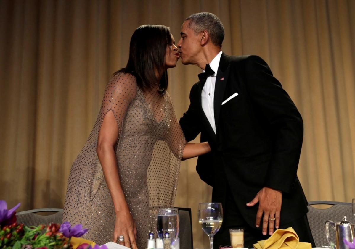 Barack Obama and Michelle Obama kiss each other at the White House Correspondents' Association annual dinner in Washington, US, April 30, 2016. Barack and Michelle Obama