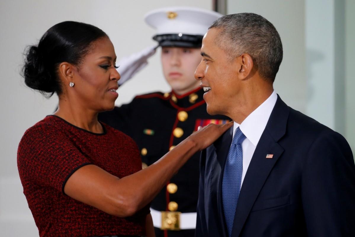 Barack Obama and Michelle Obama prepare to greet US President-elect Donald Trump and his wife Melania for tea before the inauguration at the White House in Washington, US January 20, 2017 Barack and Michelle Obama