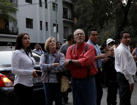 People ran out of buildings after a tremor was felt in Mexico City Mexico
