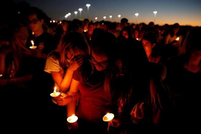 Participants hold candles for victims of the shooting in Parkland, Florida, during a candlelight vigil. florida