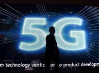 A visitors walks past a 5G sign during Mobile World Congress in Barcelona, Spain