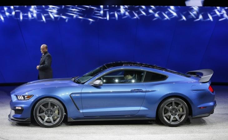 Raj Nair poses next to the company's Mustang GT 350 R during the first press preview day of the North American International Auto Show in Detroit, Michigan. raj nair