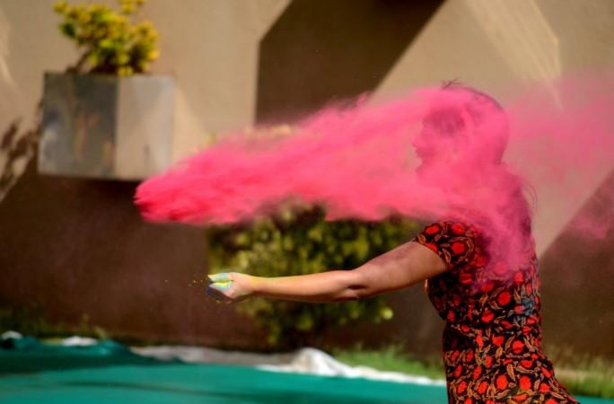 The boy threw red gulal on the girl. (Representation image) Holi