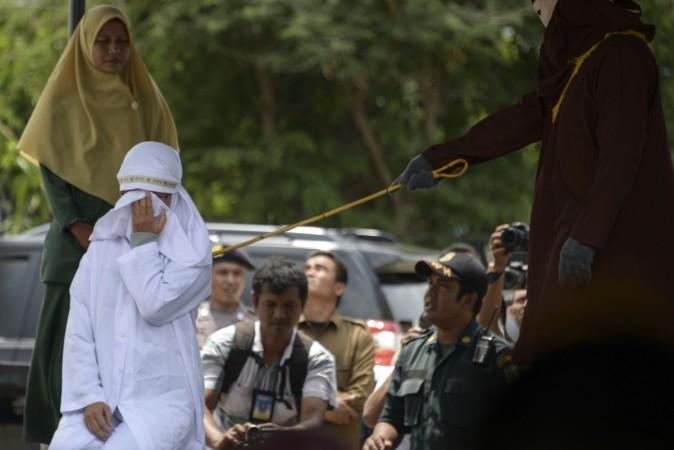 Flogged in public Two Indonesian  Christians  punished for 