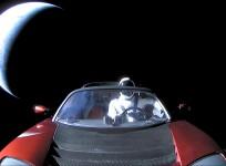 A cherry red Tesla Roadster automobile floats through space after it was carried there by SpaceX's Falcon Heavy in this image obtained by Reuters on February 9, 2018.