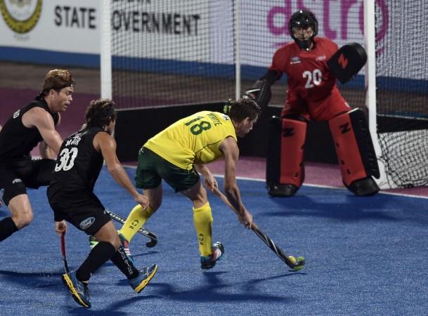 Australia hockey team (yellow jersey) in action during the Sultan Azlan Shah Cup hockey tournament in 2015 Australia hockey team during the Sultan Azlan Shah Cup hockey tournament in 2015