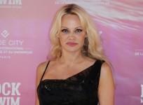 Pamela Anderson poses before attending the Rock My Swim by Mode City Paris fashion show in Paris on July 8, 2017.