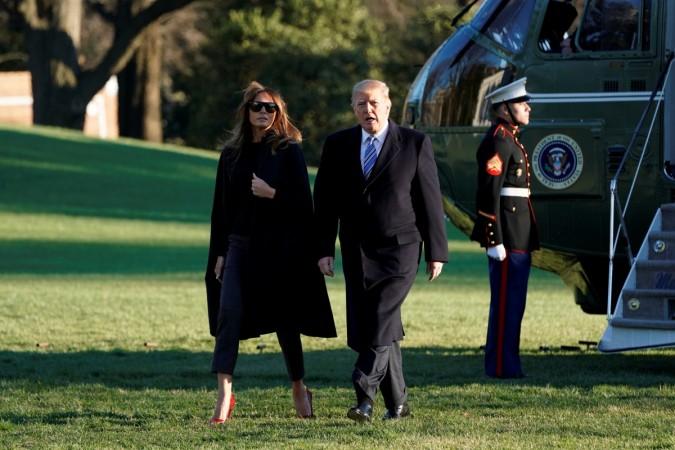 U.S. President Donald Trump walks with first lady Melania Trump Melania and Donald Trump