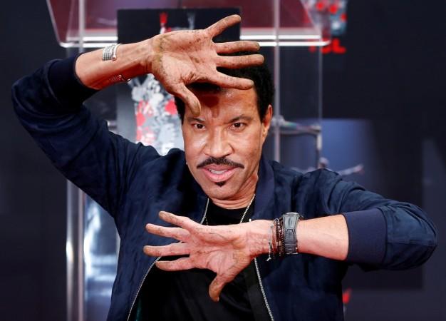 Recording artist Lionel Richie shows his hands after placing them in cement during a ceremony in the forecourt of the TCL Chinese theatre in Los Angeles, California, U.S., March 7, 2018. Recording artist Lionel Richie shows his hands after placing them in cement during a ceremony in the forecourt of the TCL Chinese theatre in Los Angeles, California, U.S., March 7, 2018.