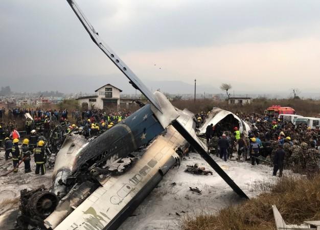 Wreckage of an airplane is pictured as rescue workers operate at Kathmandu airport, Nepal March 12, 2018. Wreckage of an airplane is pictured as rescue workers operate at Kathmandu airport, Nepal March 12, 2018.