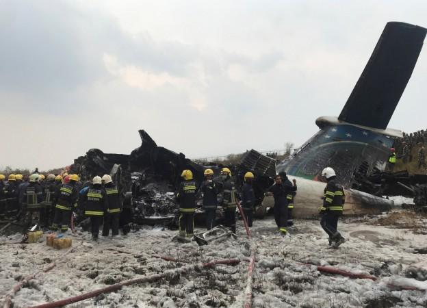 Wreckage of an airplane is pictured as rescue workers operate at Kathmandu airport, Nepal March 12, 2018. Wreckage of an airplane at Kathmandu airport