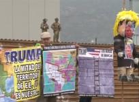Protesters greet President Trump as he visits border wall prototypes