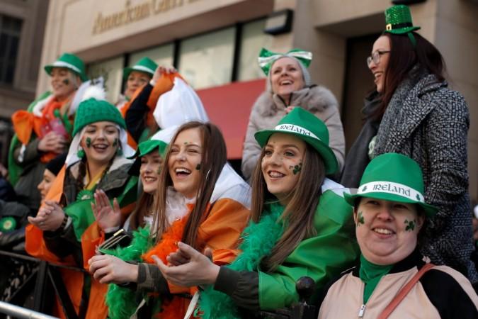 Paradegoers watch the St Patrick's Day parade on 5th Avenue in New York City, U.S., March 17, 2017.