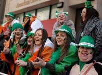 Paradegoers watch the St Patrick's Day parade on 5th Avenue in New York City, U.S., March 17, 2017.