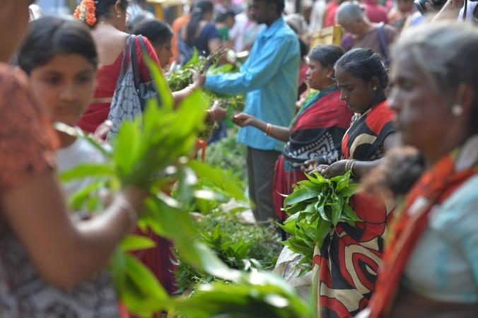 South Indian Hindus buy mango and neem leaves, used during events to mark the Hindu New Year, at a market in Bangalore. Ugadi