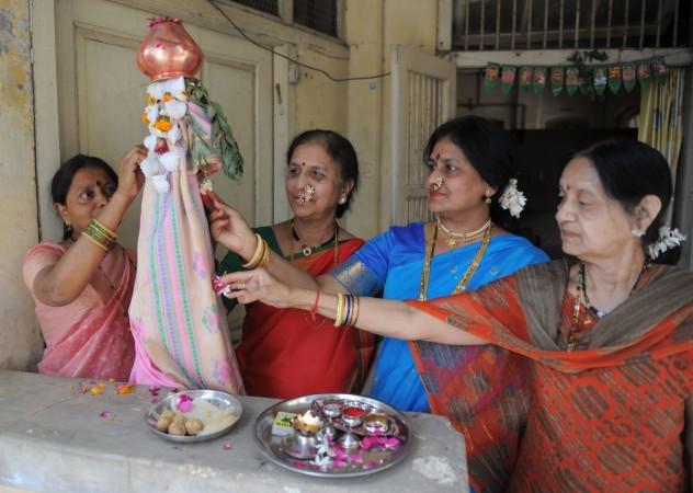 Indian women dressed in traditional attire take part in a prayer celebrating 'Gudhi Padwa' Gudi Padwa