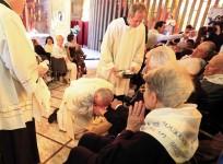 Pope Francis kisses a foot of a disabled person at the S. Maria della Provvidenza church in Rome, during the Holy Thursday celebration, April 17, 2014.