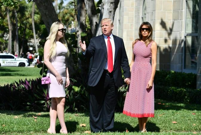 US President Donald Trump(C) with First Lady Melania Trump(R) and daughter Tiffany Trump (L) arrive for Easter service at the Church of Bethesda-by-the-Sea in Palm Beach, Florida, April 1, 2018. Melania Trump