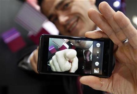 Man displayed LG Optimus 3D during the GSMA Mobile World Congress in Barcelona